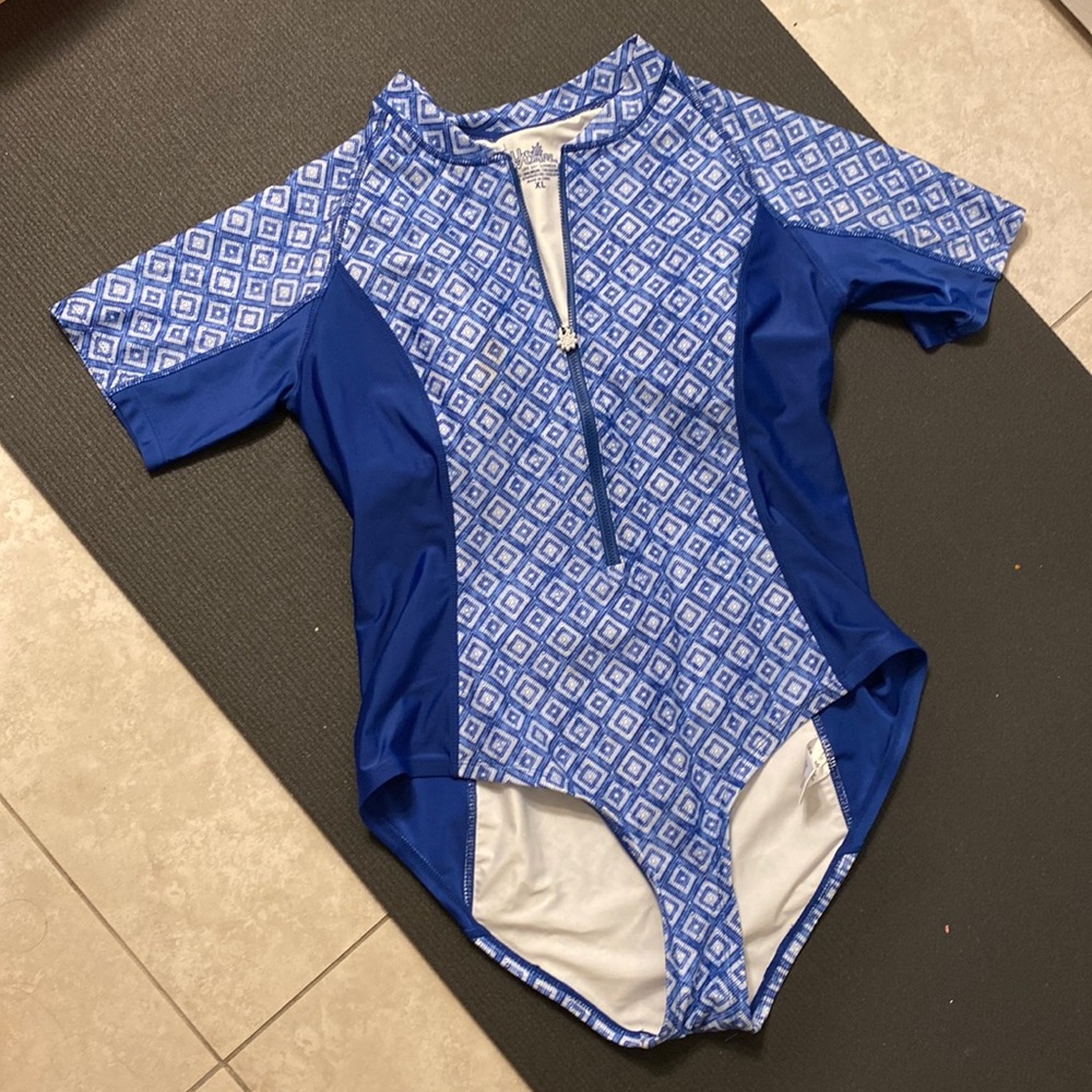 Brand new UV Skinz Swim suit with zip closure. Never worn